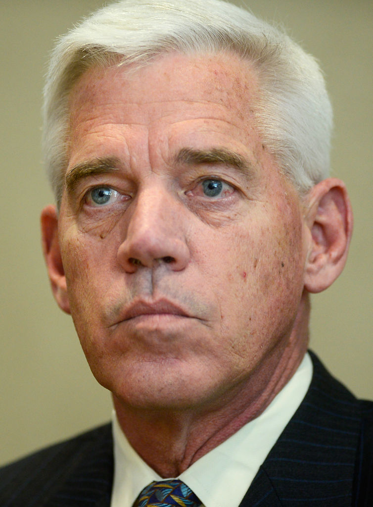 Skip Walther listens to another candidate during a forum